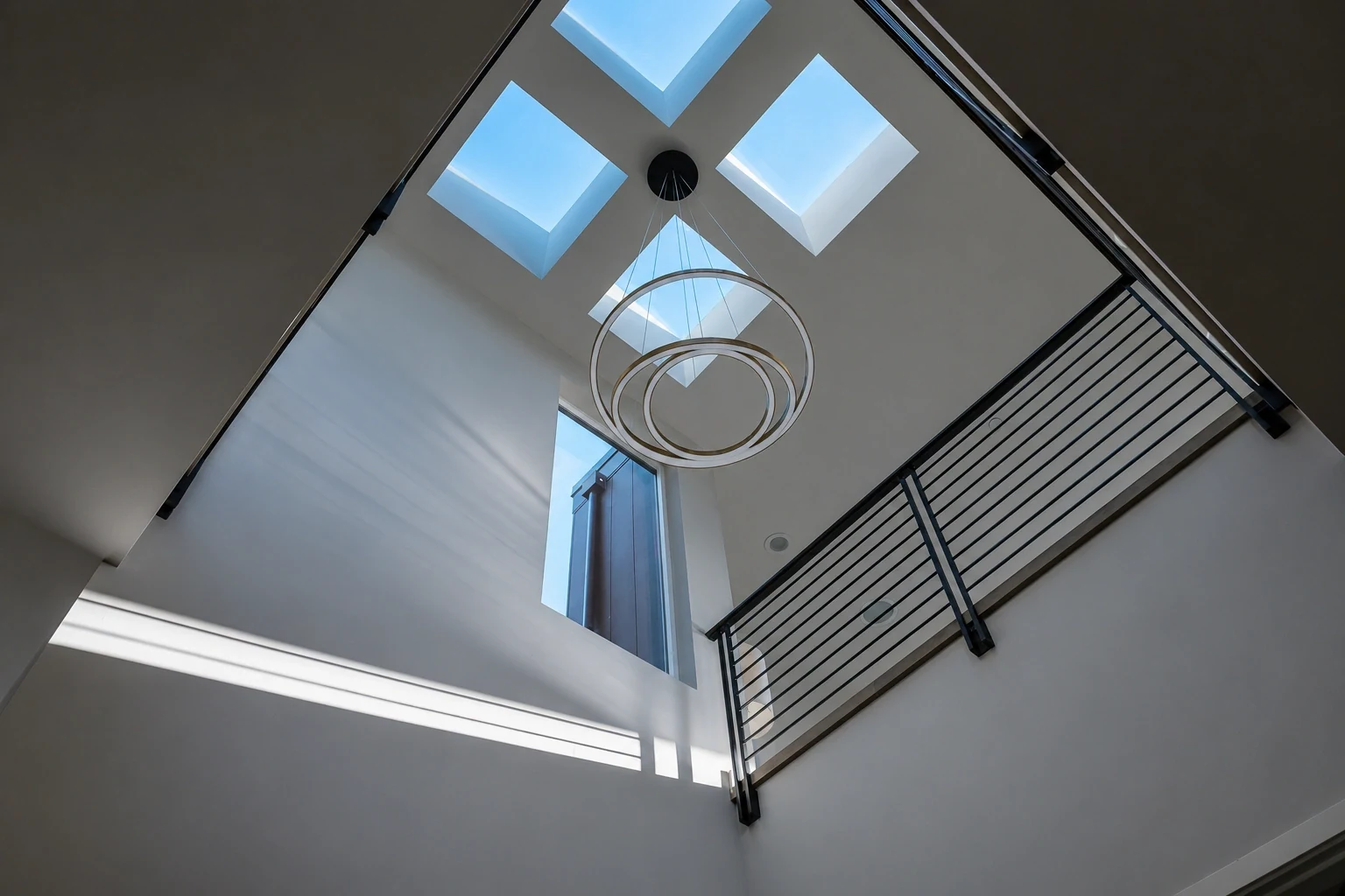 Ring pendant beneath skylights