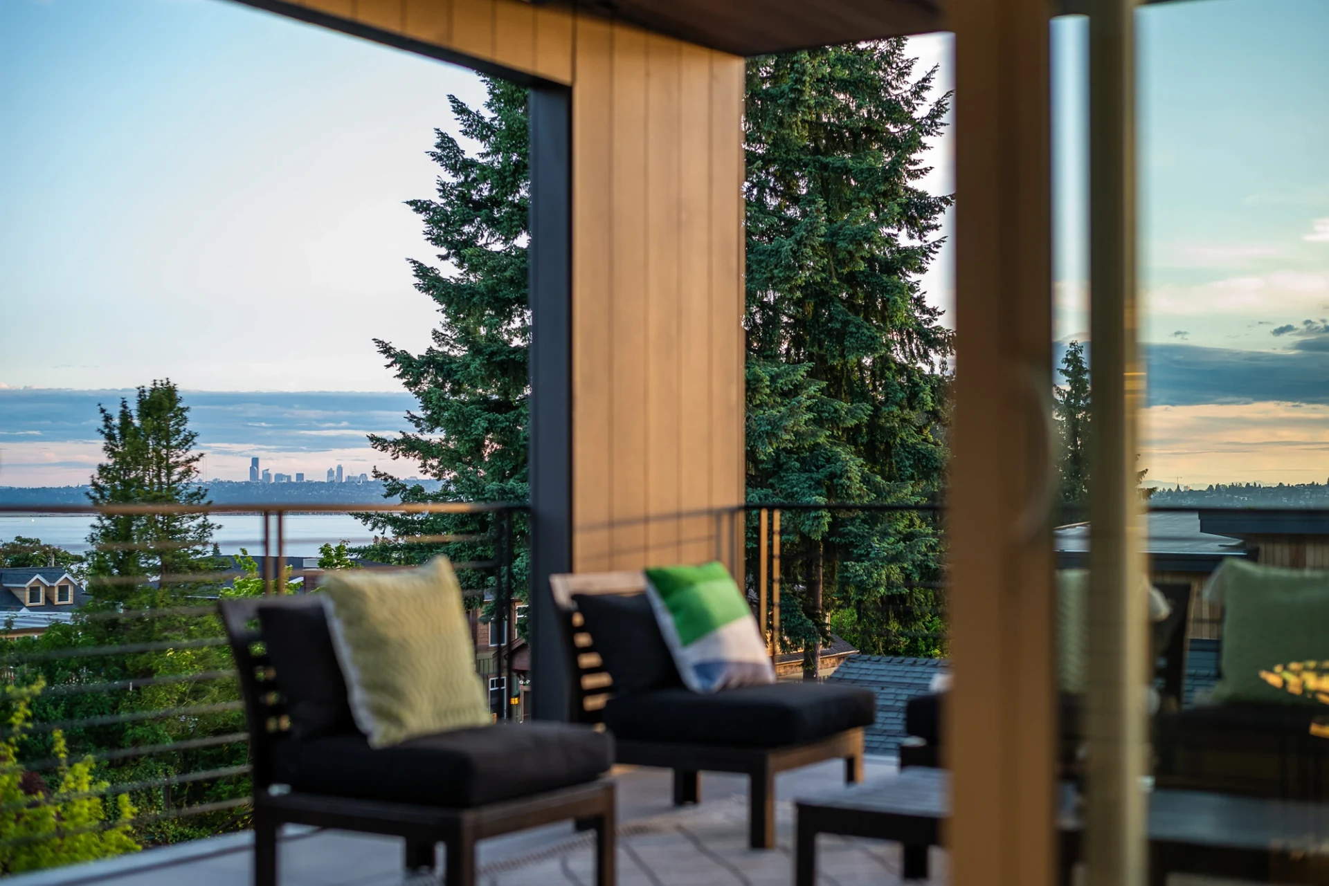 A timber terrace looking across Northwest water